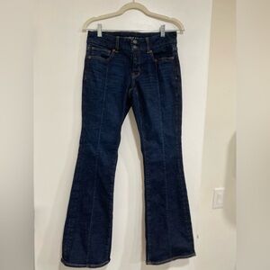 American Eagle Next Level Low-rise Kick Bootcut Jeans, dark wash front leg seams